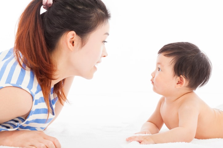 Happy  mother talking with  baby boy